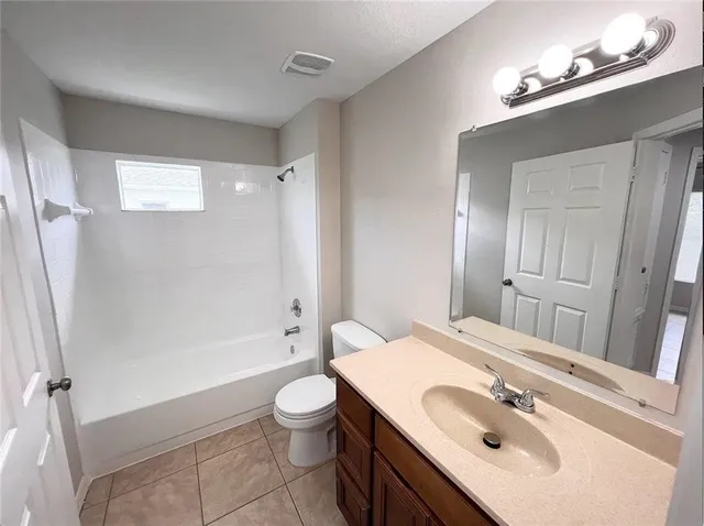 a bathroom with a sink toilet tub and shower