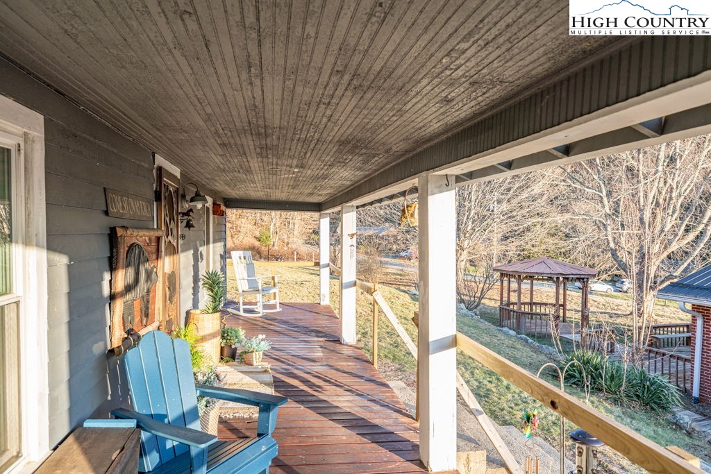 40 Painter Road Banner Elk, NC 28604 - Photo 16 of 45 a view of a living room and balcony with wooden floor