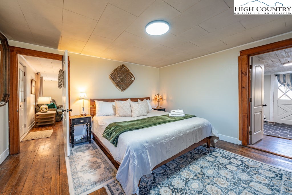 40 Painter Road Banner Elk, NC 28604 - Photo 21 of 45 a bedroom with bed and wooden floor