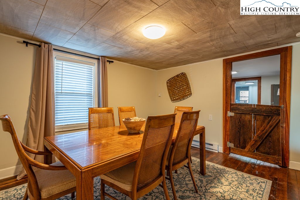 40 Painter Road Banner Elk, NC 28604 - Photo 4 of 45 a view of a dining room with furniture and a window