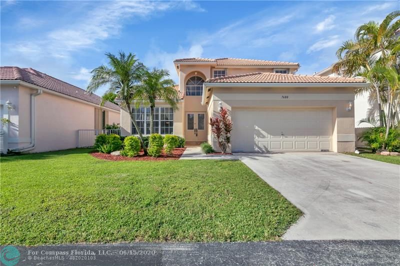 7680 Belmonte Boulevard Margate, FL 33063 - Photo 1 of 30 a view of a house with a yard and plants
