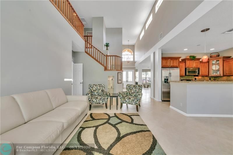7680 Belmonte Boulevard Margate, FL 33063 - Photo 11 of 30 a living room with furniture kitchen and a table