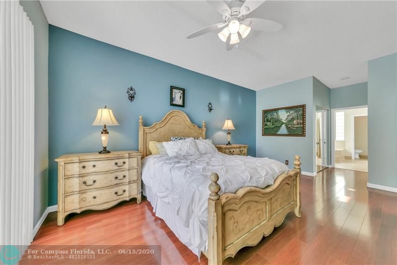 7680 Belmonte Boulevard Margate, FL 33063 - Photo 14 of 30 a living room with furniture and a chandelier