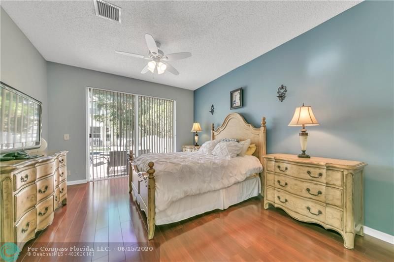 7680 Belmonte Boulevard Margate, FL 33063 - Photo 15 of 30 a bed room with a bed and a tv