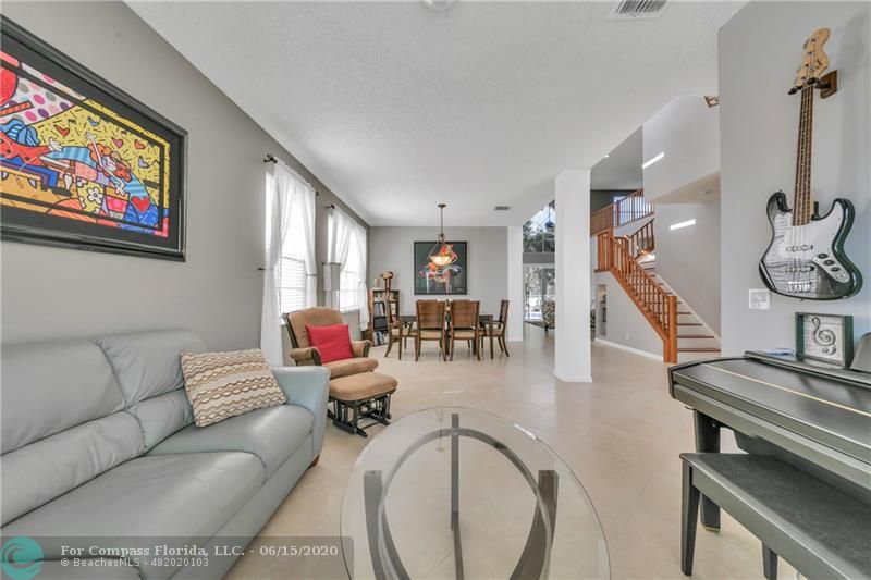 7680 Belmonte Boulevard Margate, FL 33063 - Photo 2 of 30 a living room with furniture and wooden floor