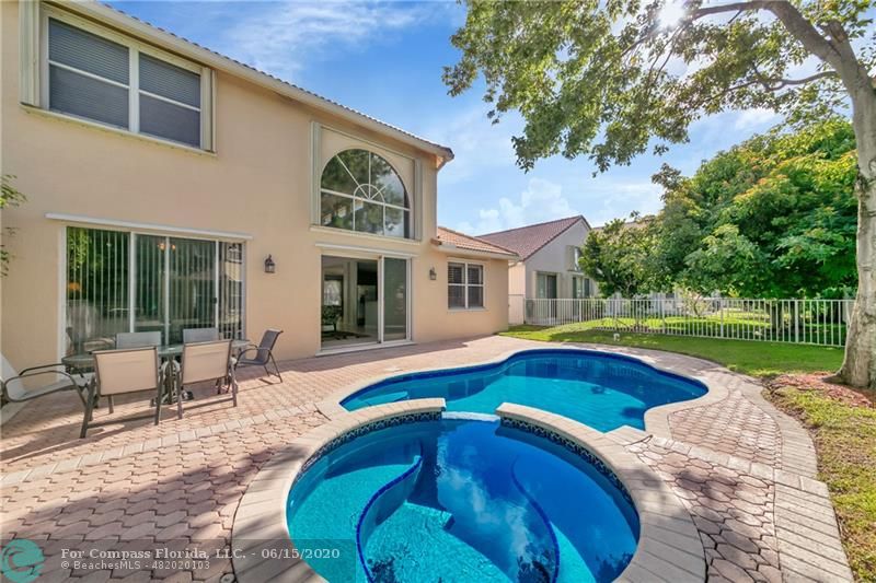 7680 Belmonte Boulevard Margate, FL 33063 - Photo 28 of 30 a swimming pool with outdoor seating and yard