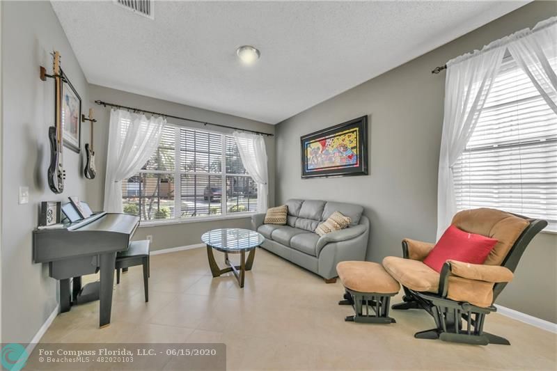 7680 Belmonte Boulevard Margate, FL 33063 - Photo 3 of 30 a living room with furniture and a large window