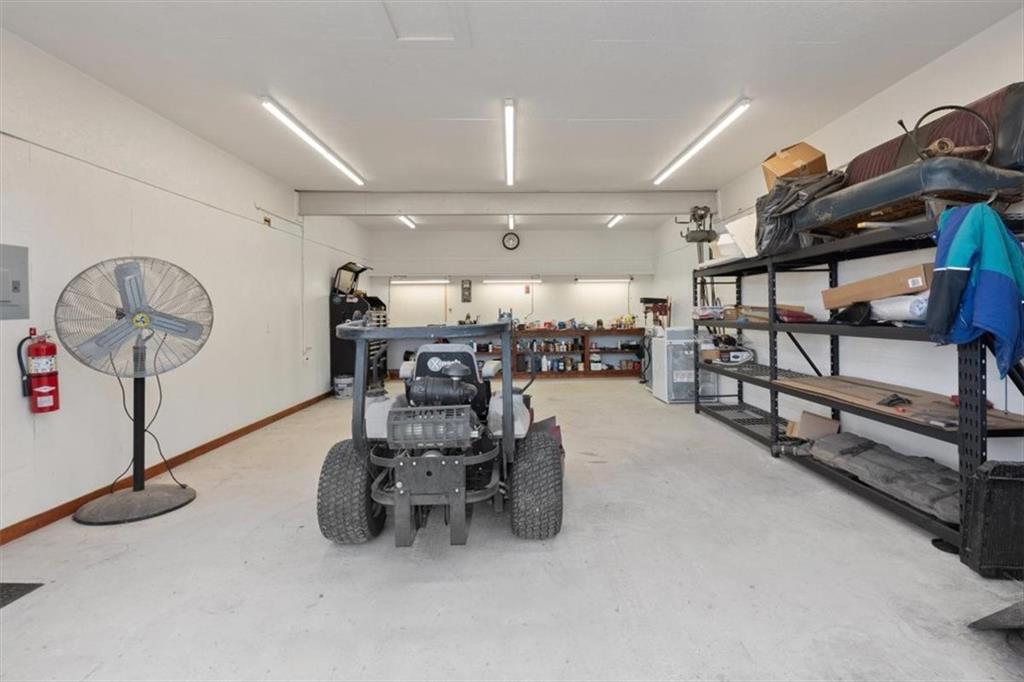 3186 Highway 411 White, GA 30184 - Photo 17 of 20 a room with lots of wooden furniture and a chandelier