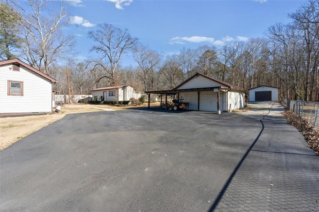 3186 Highway 411 White, GA 30184 - Photo 18 of 20 a view of a house with a yard