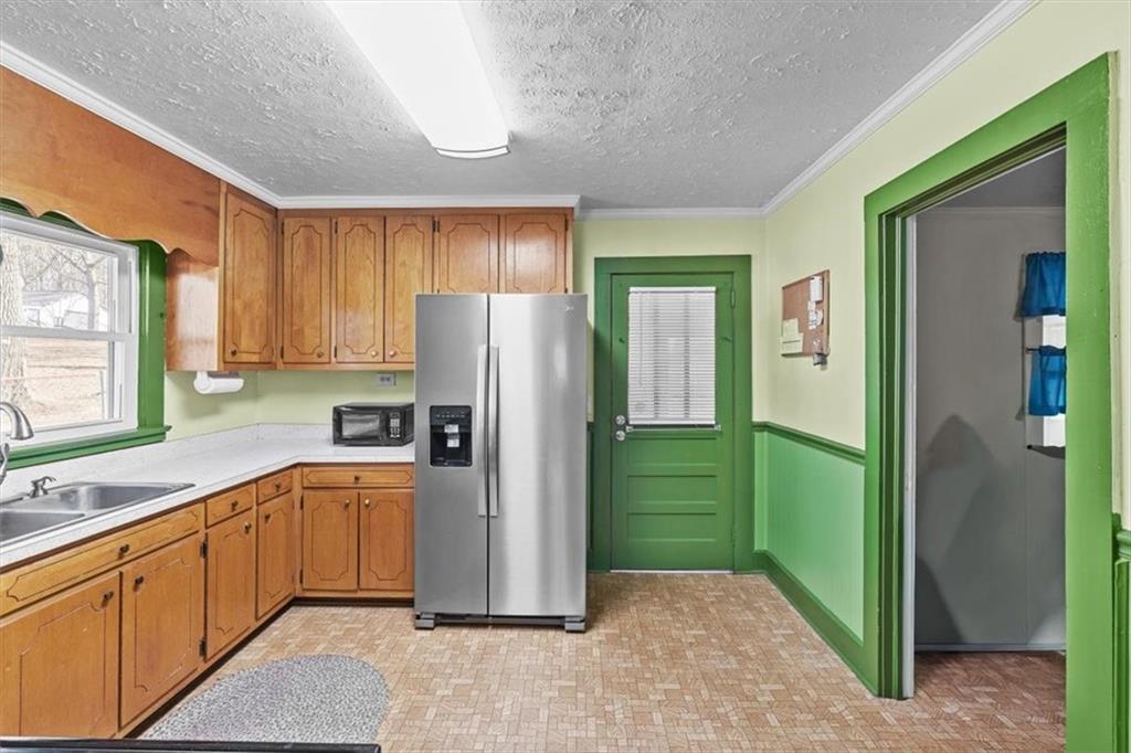 3186 Highway 411 White, GA 30184 - Photo 4 of 20 a kitchen with a refrigerator a sink and dishwasher