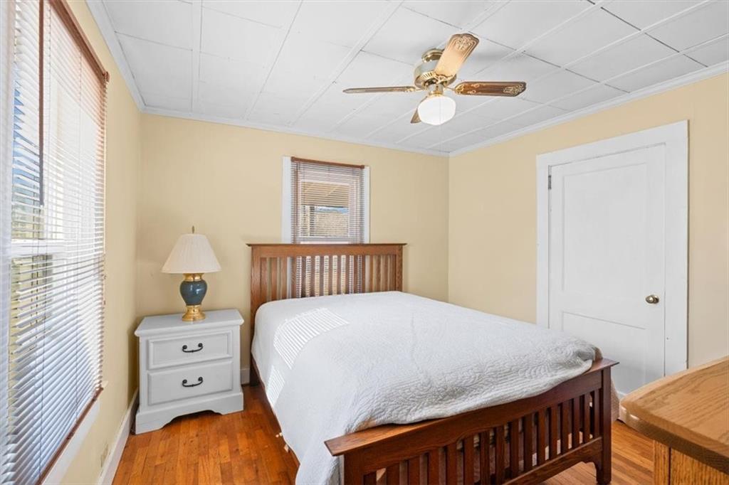 3186 Highway 411 White, GA 30184 - Photo 9 of 20 a bedroom with a bed and a chandelier