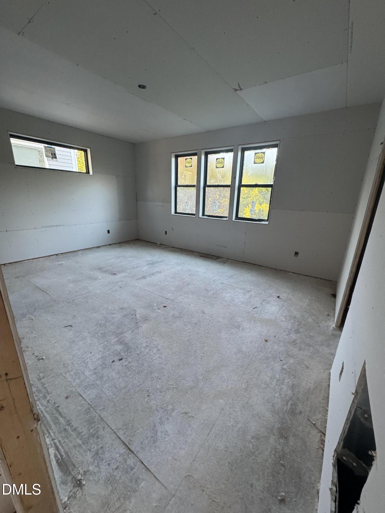 615 Velma Hopkins Lane Raleigh, NC 27603 - Photo 12 of 16 a view of an empty room with a window