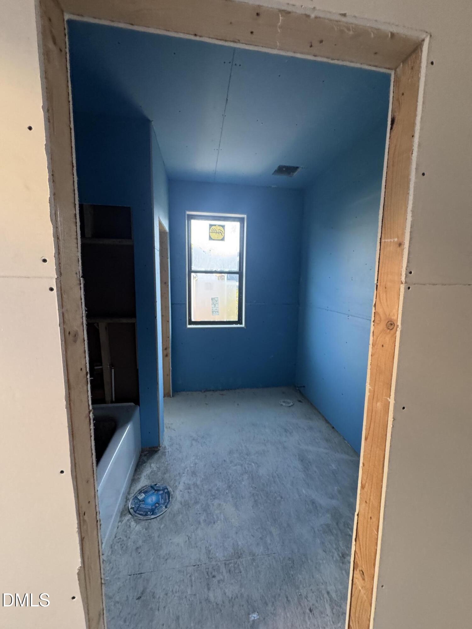 615 Velma Hopkins Lane Raleigh, NC 27603 - Photo 13 of 16 an empty room with windows