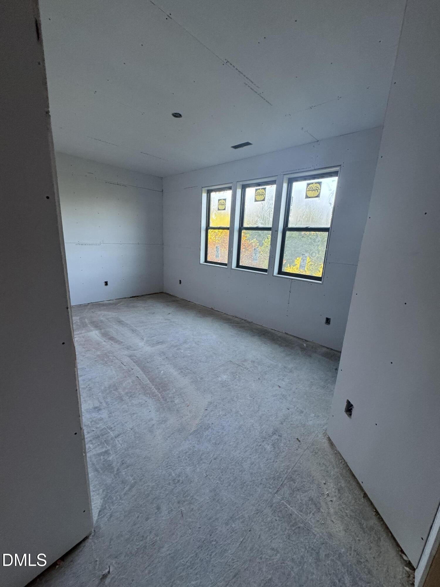 615 Velma Hopkins Lane Raleigh, NC 27603 - Photo 15 of 16 an empty room with windows