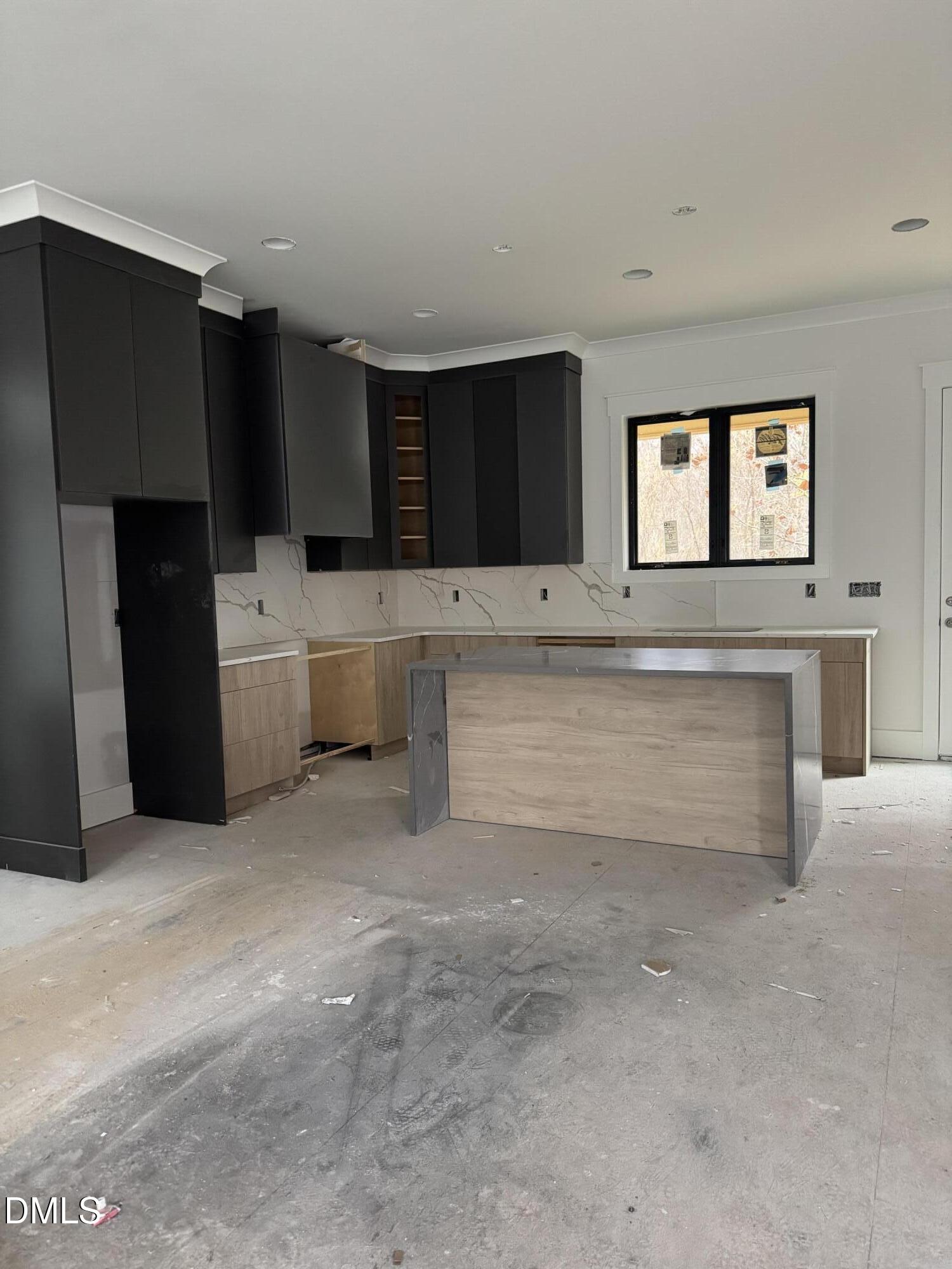 615 Velma Hopkins Lane Raleigh, NC 27603 - Photo 7 of 16 a living room with stainless steel appliances kitchen island a cabinets and a couch