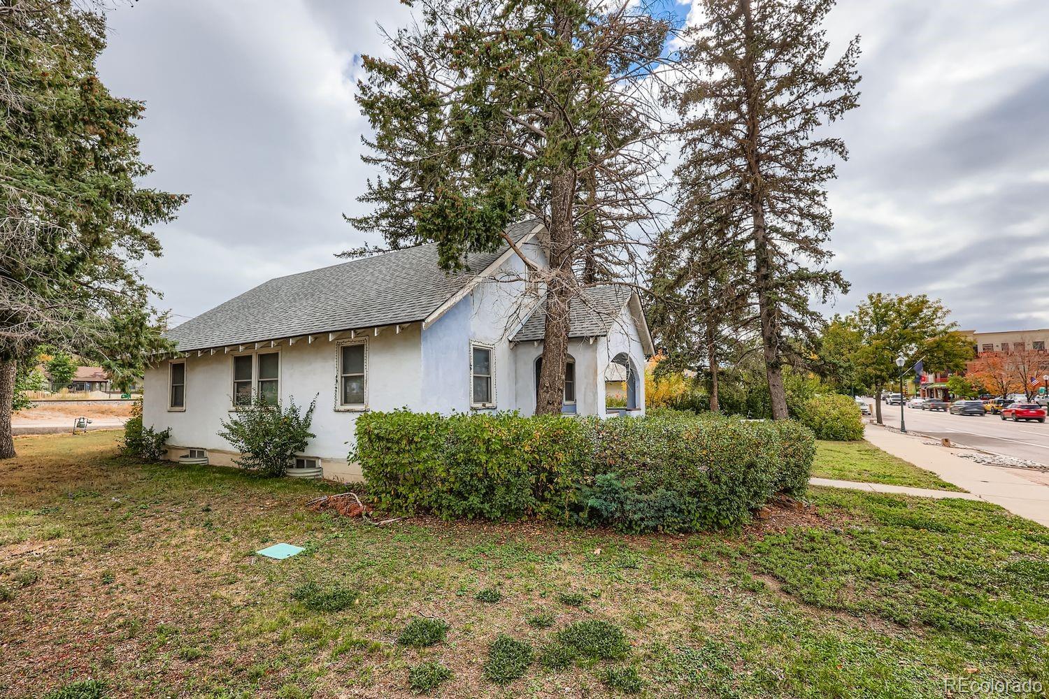 422 Perry Street Castle Rock, CO 80104 - Photo 15 of 33 a front view of a house with a yard and garage