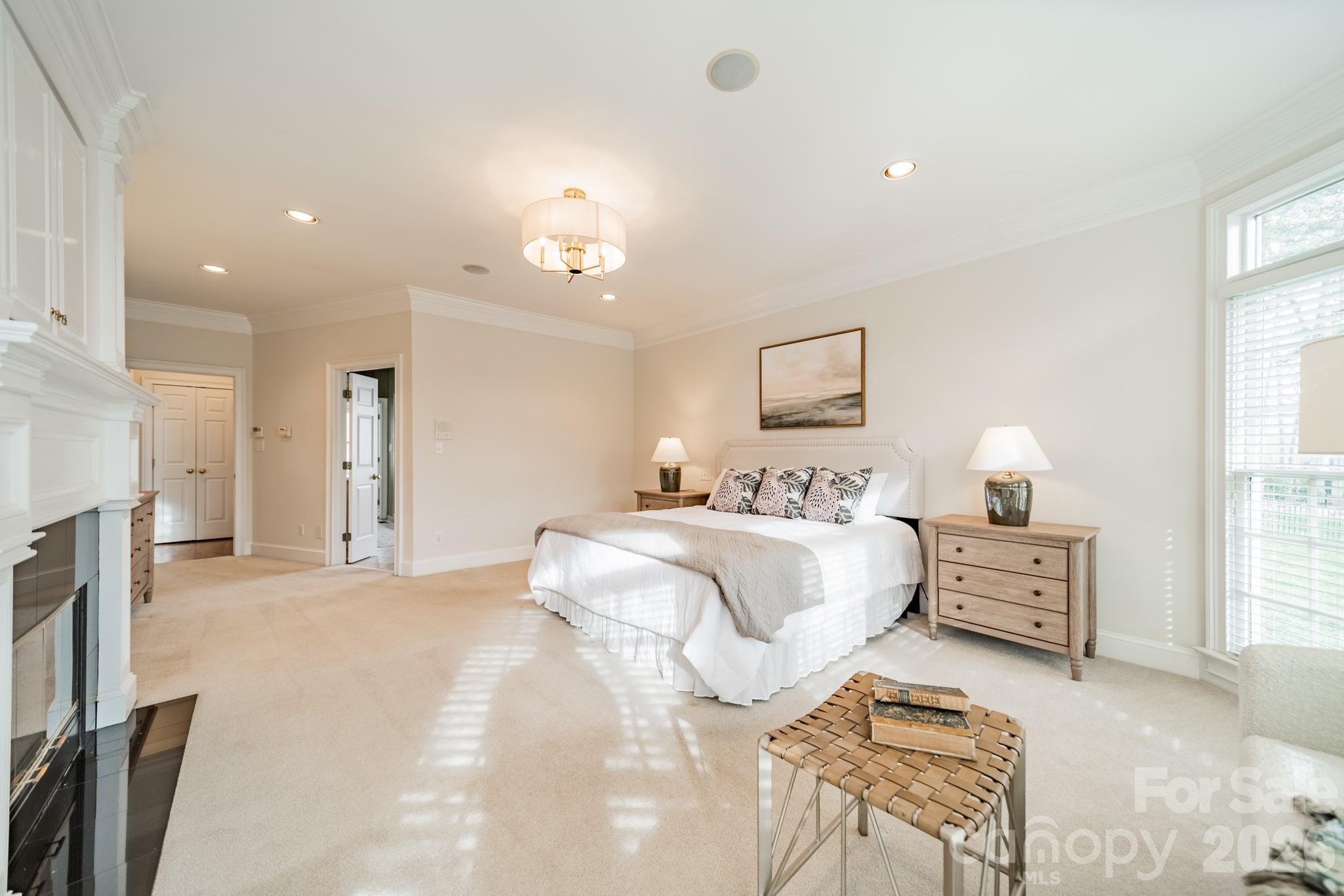 18908 Riverwind Lane Davidson, NC 28036 - Photo 17 of 35 a spacious bedroom with a bed and a couch