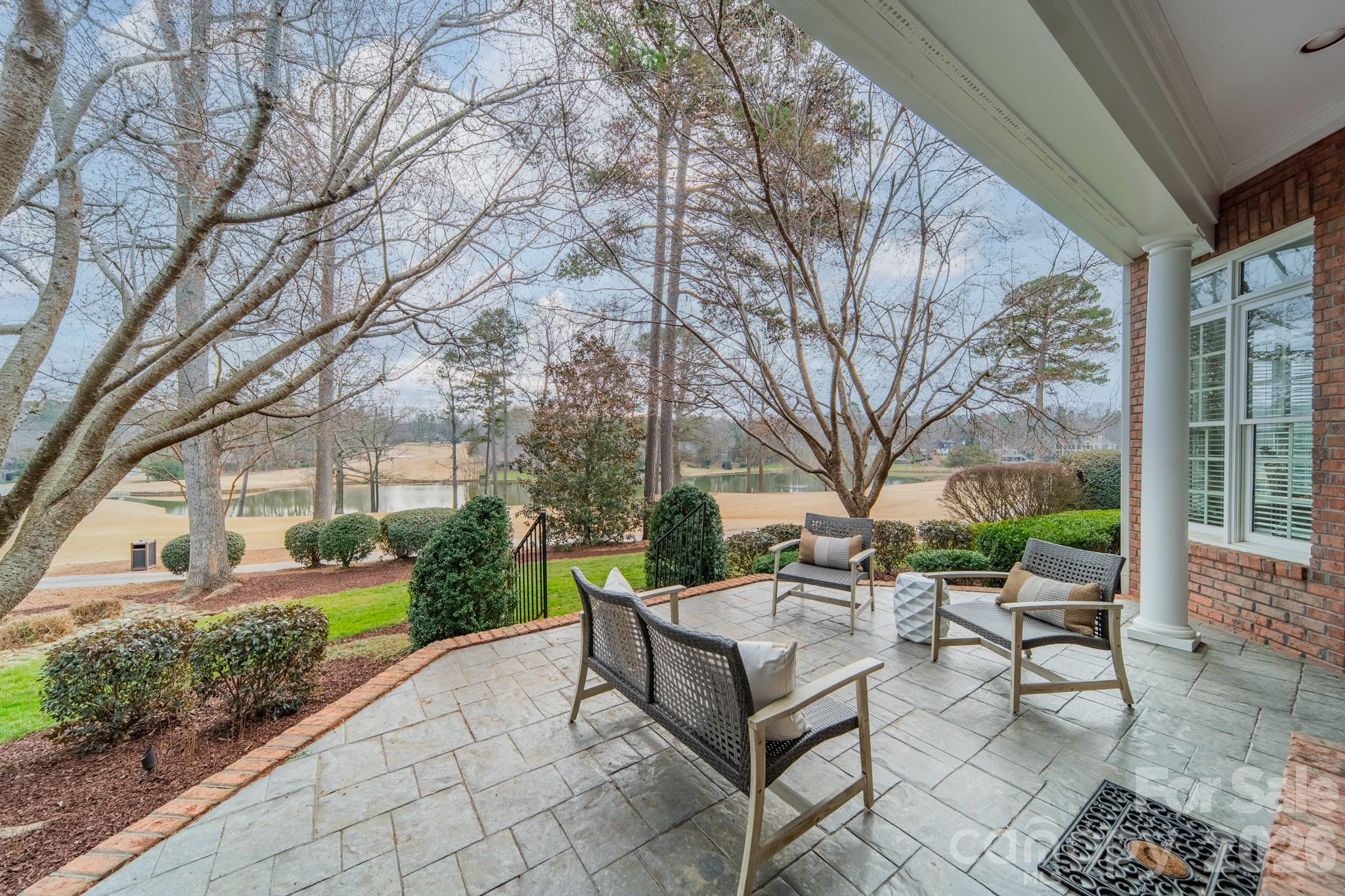 18908 Riverwind Lane Davidson, NC 28036 - Photo 29 of 35 a view of a patio with table and chairs and potted plants