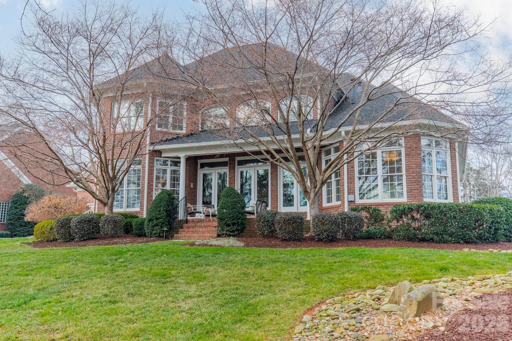 18908 Riverwind Lane Davidson, NC 28036 - Photo 34 of 35 a front view of a house with garden