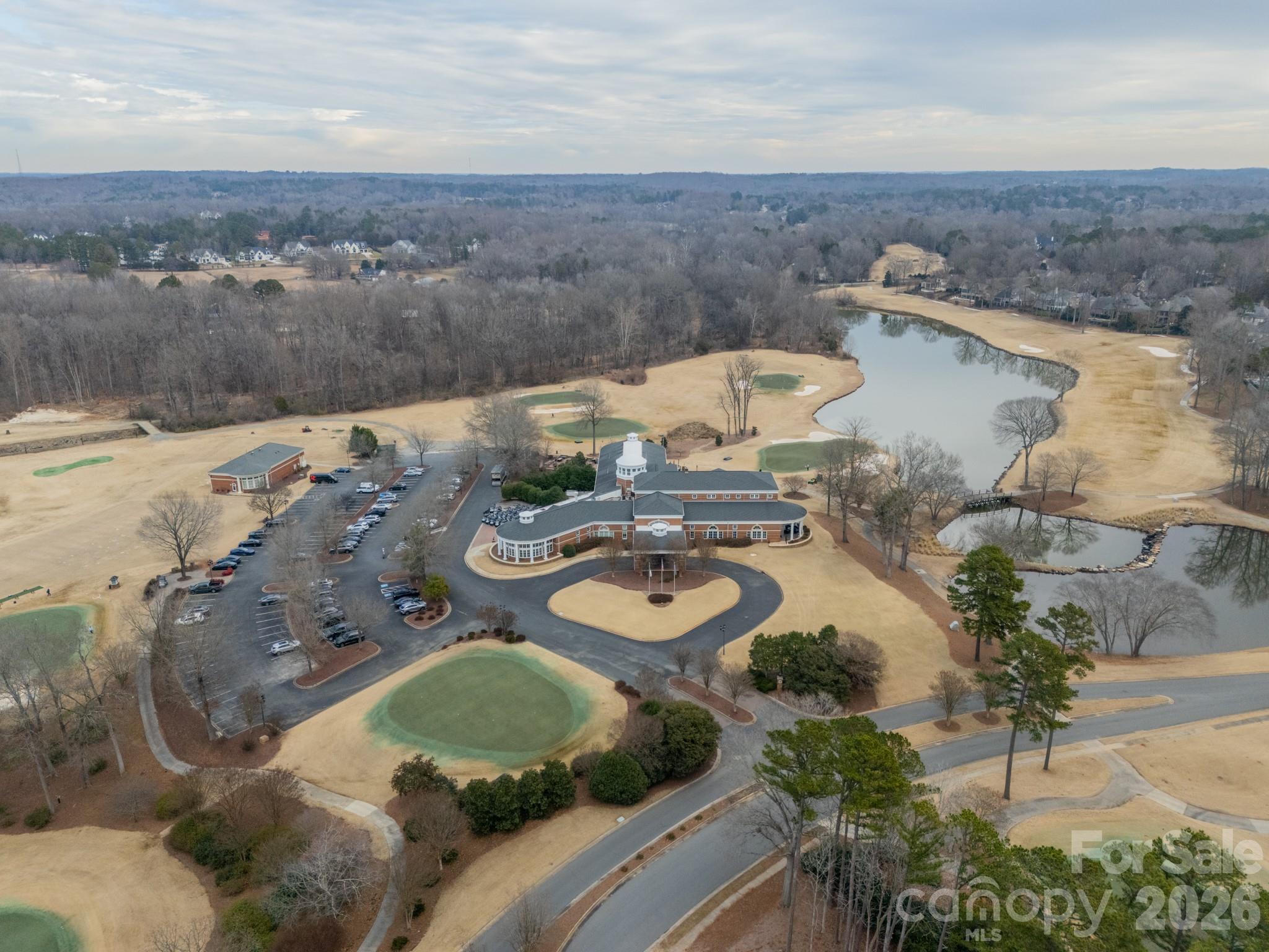 18908 Riverwind Lane Davidson, NC 28036 - Photo 5 of 35 an aerial view of a house with a yard and lake view
