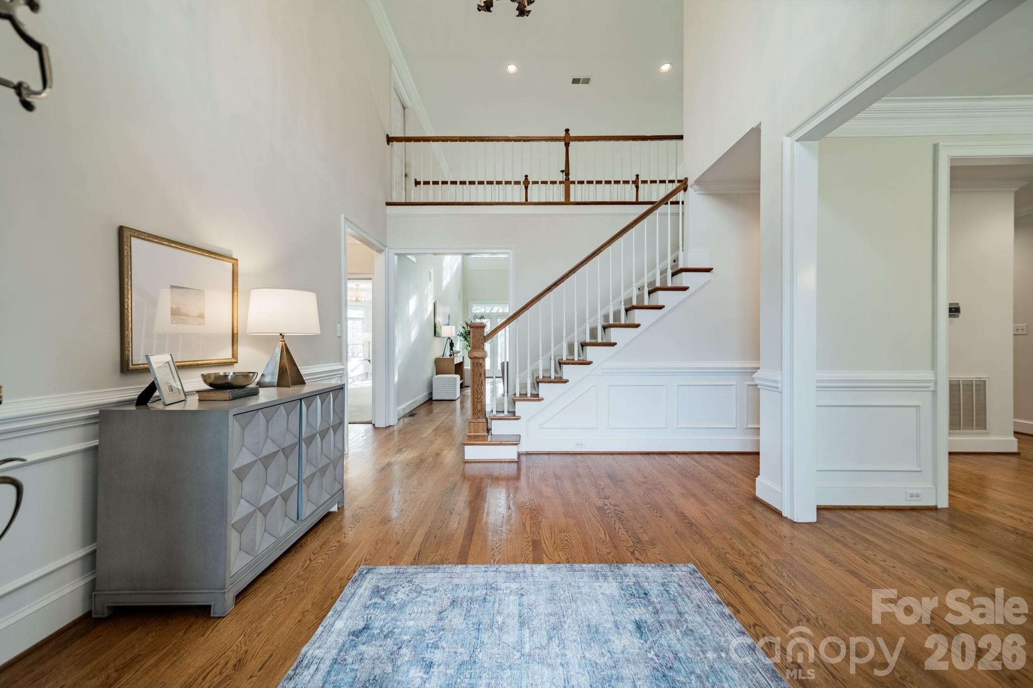 18908 Riverwind Lane Davidson, NC 28036 - Photo 6 of 35 a view of entryway and kitchen with wooden floor