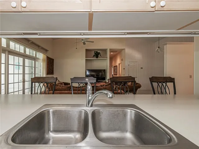 a kitchen with kitchen island a sink and a counter top space