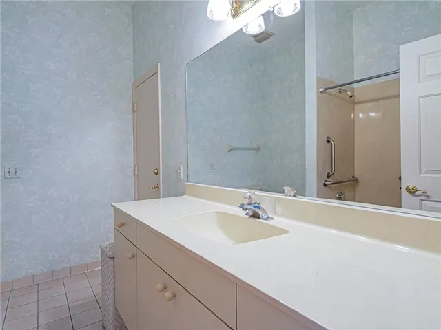 a bathroom with a sink and a mirror