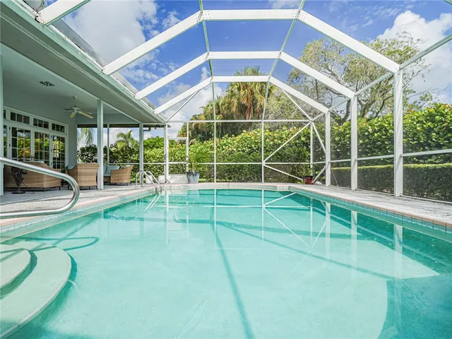a view of a room with wooden floor and windows