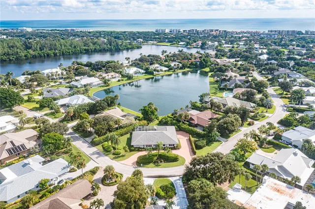 an aerial view of a city with lake view