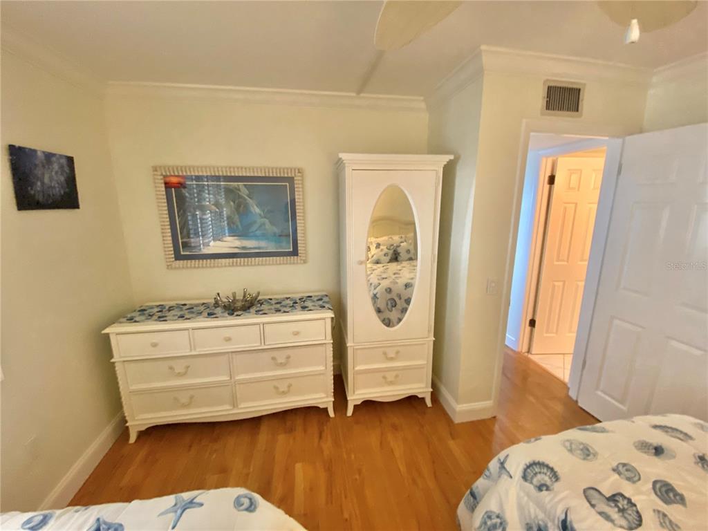 6035 Sea Ranch Drive, Unit 901 Hudson, FL 34667 - Photo 14 of 72 a bedroom with a bed and a window