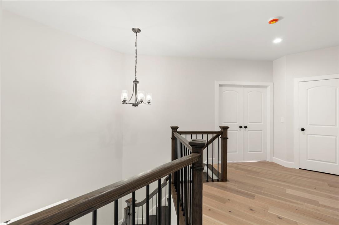Hottle Road Quakertown, PA 18951 - Photo 26 of 59 An upper landing boasts hardwood flooring and a classic wooden staircase banister.