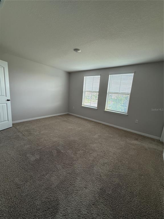 13251 Pontoon Road Winter Garden, FL 34787 - Photo 11 of 24 an empty room with windows