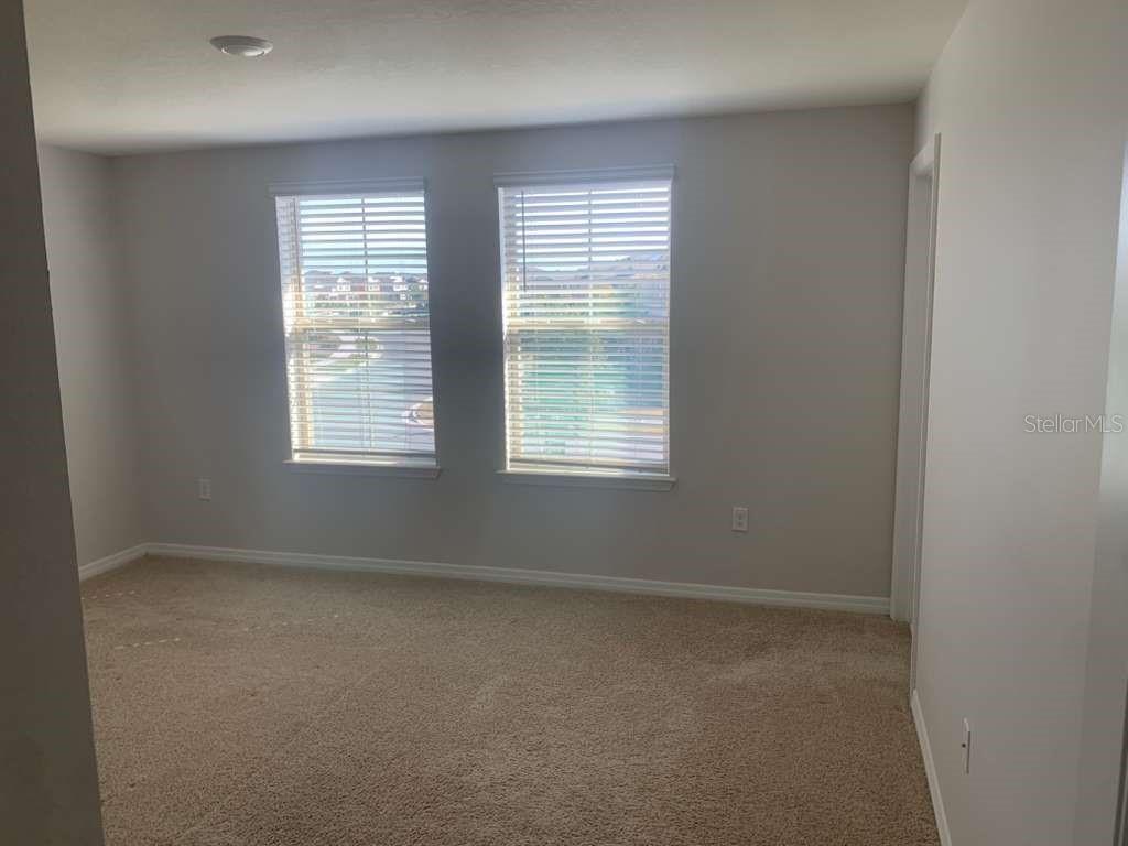 13251 Pontoon Road Winter Garden, FL 34787 - Photo 12 of 24 an empty room with a window