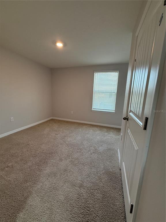 13251 Pontoon Road Winter Garden, FL 34787 - Photo 18 of 24 an empty room with windows