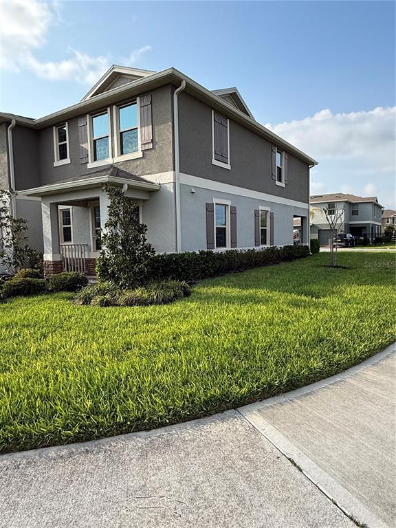 13251 Pontoon Road Winter Garden, FL 34787 - Photo 24 of 24 a front view of a house with a yard