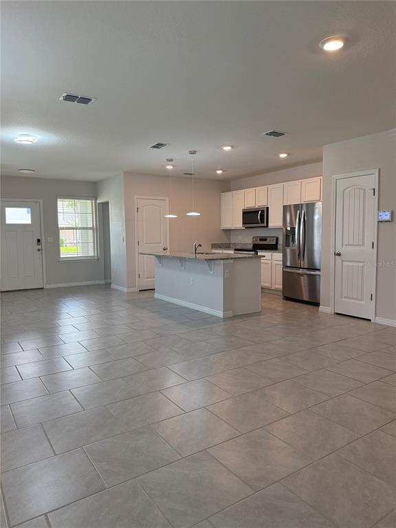 13251 Pontoon Road Winter Garden, FL 34787 - Photo 4 of 24 a view of a kitchen with a sink