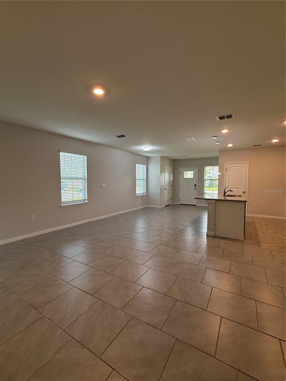 13251 Pontoon Road Winter Garden, FL 34787 - Photo 6 of 24 a view of a hallway with windows