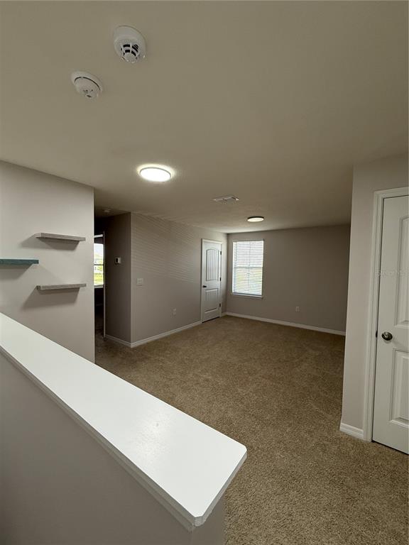 13251 Pontoon Road Winter Garden, FL 34787 - Photo 9 of 24 a view of an empty room and window