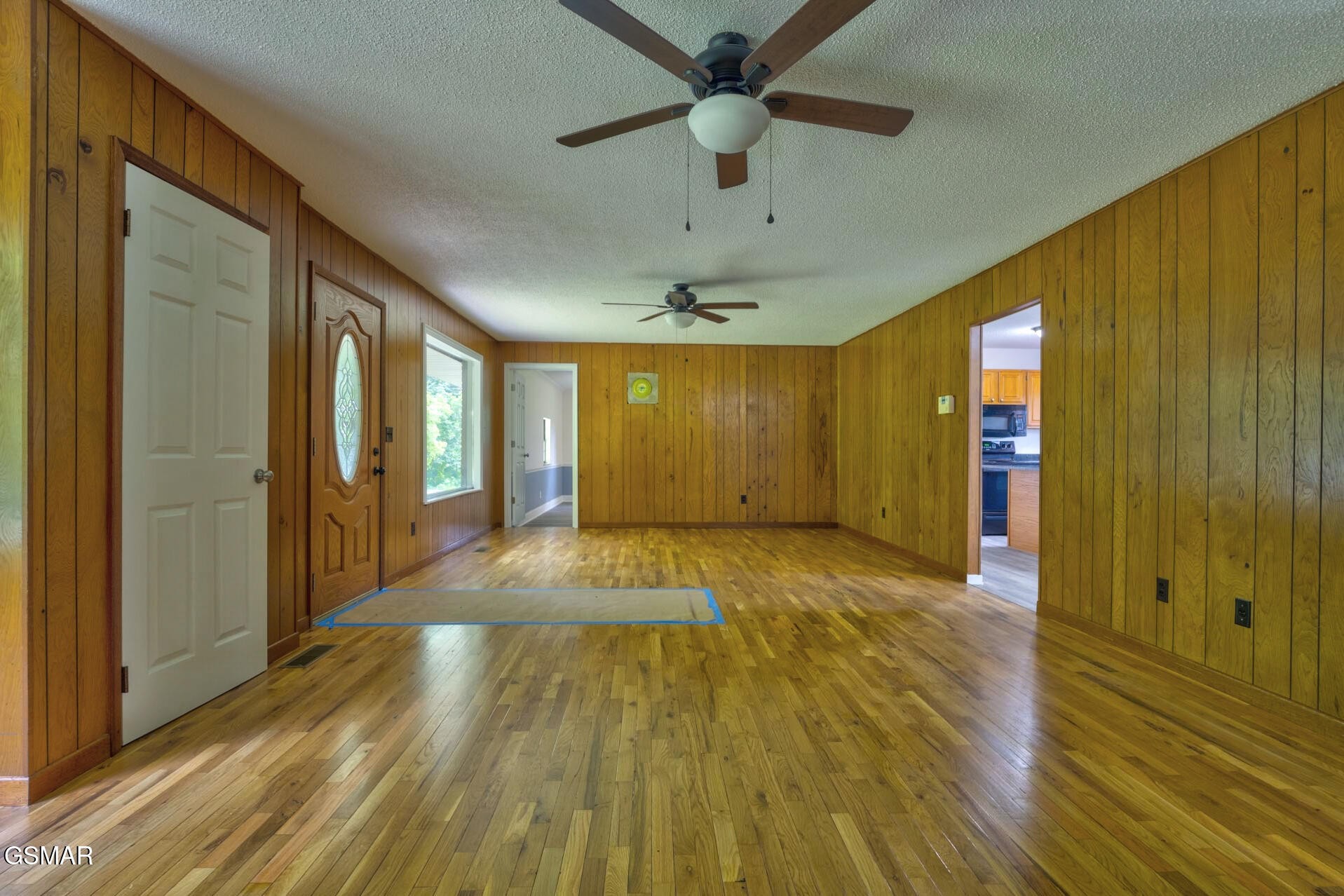 4405 Pearl Valley Road Sevierville, TN 37876 - Photo 7 of 39 a view of a room with wooden floor and entryway