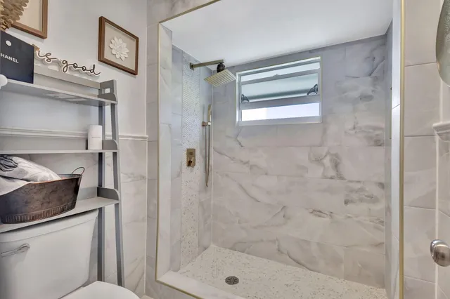 a bed room with a bed and a television