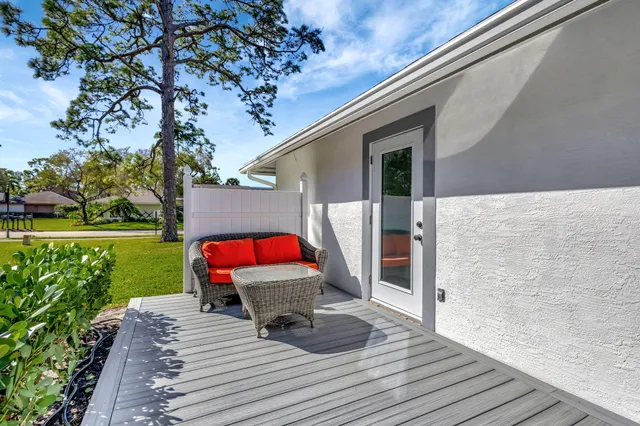 a backyard of a house with seating space