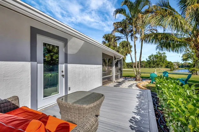 a view of a backyard with sitting area