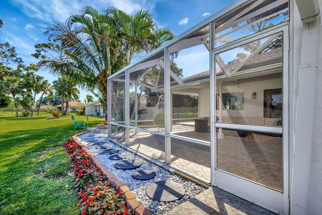 an outdoor sitting area with golf course