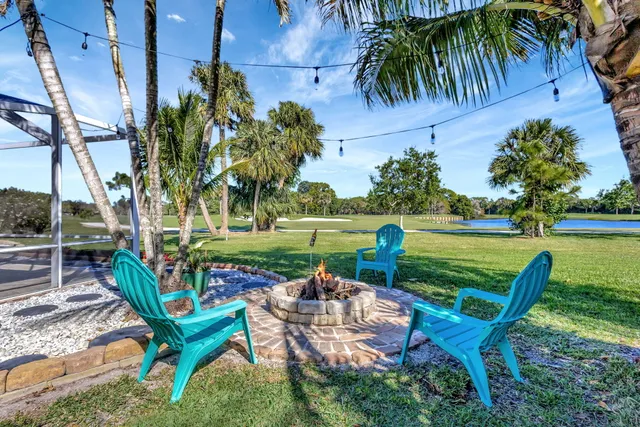 a living room with couch and a floor to ceiling window