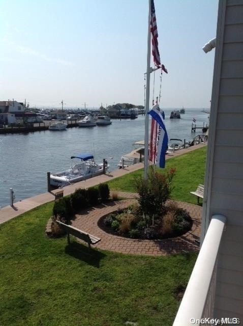 30 Watergate Lane, Unit 530 Patchogue, NY 11772 - Photo 1 of 1 a view of a lake with a outdoor space