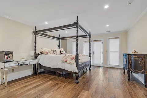 a bed room with a bed and a chair