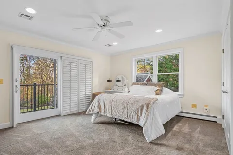 a living room with furniture a table and a large window