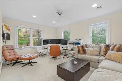 a living room with a table and a window