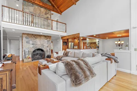a view of a bedroom with a large bed and a fireplace