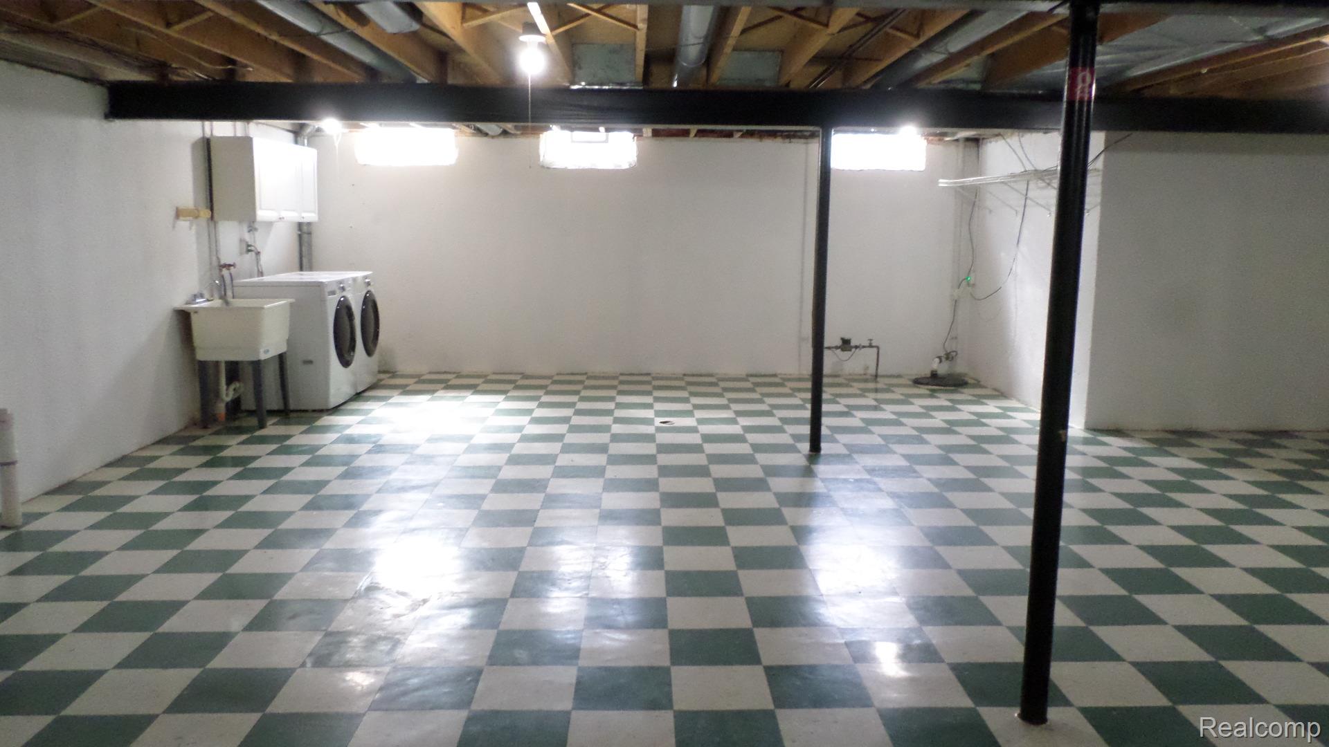 33831 Hooker Road, Unit 6 New Baltimore, MI 48047 - Photo 24 of 34 Basement featuring light floors and washing machine and dryer